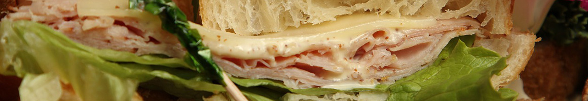 Eating Sandwich at Monster Subs restaurant in Oakland Park, FL.